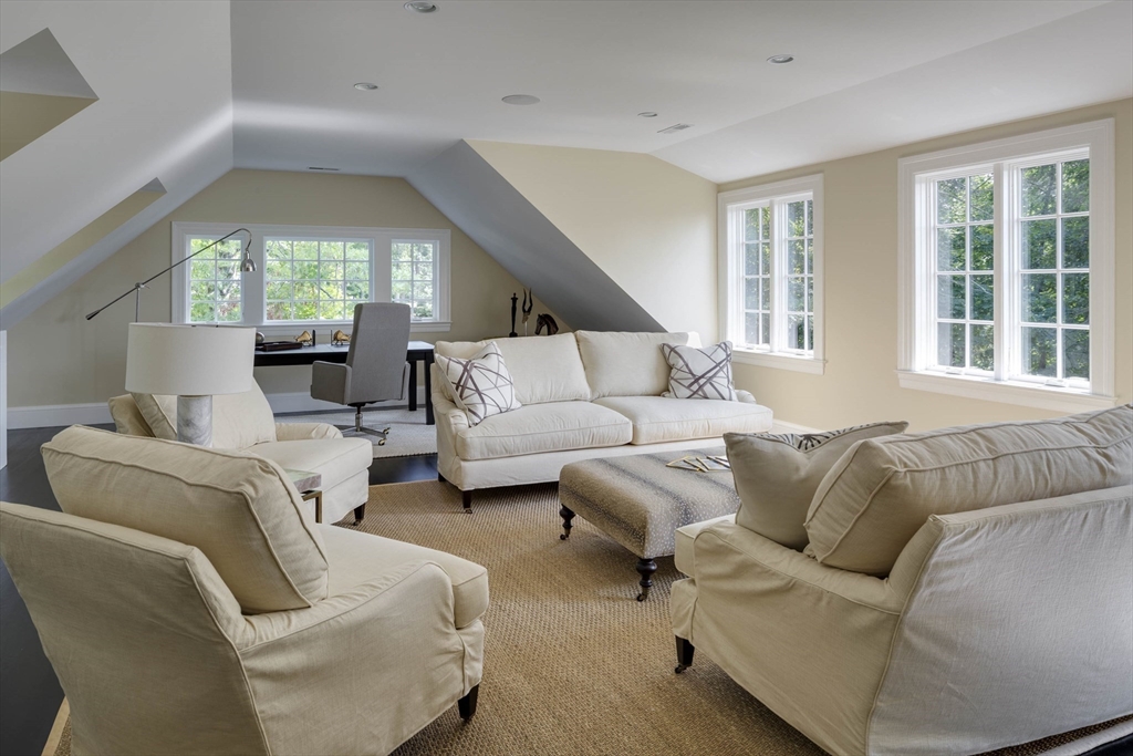 1 Adams Street Lexington, MA 02420 - Photo 15 of 20 a living room with furniture and a large window