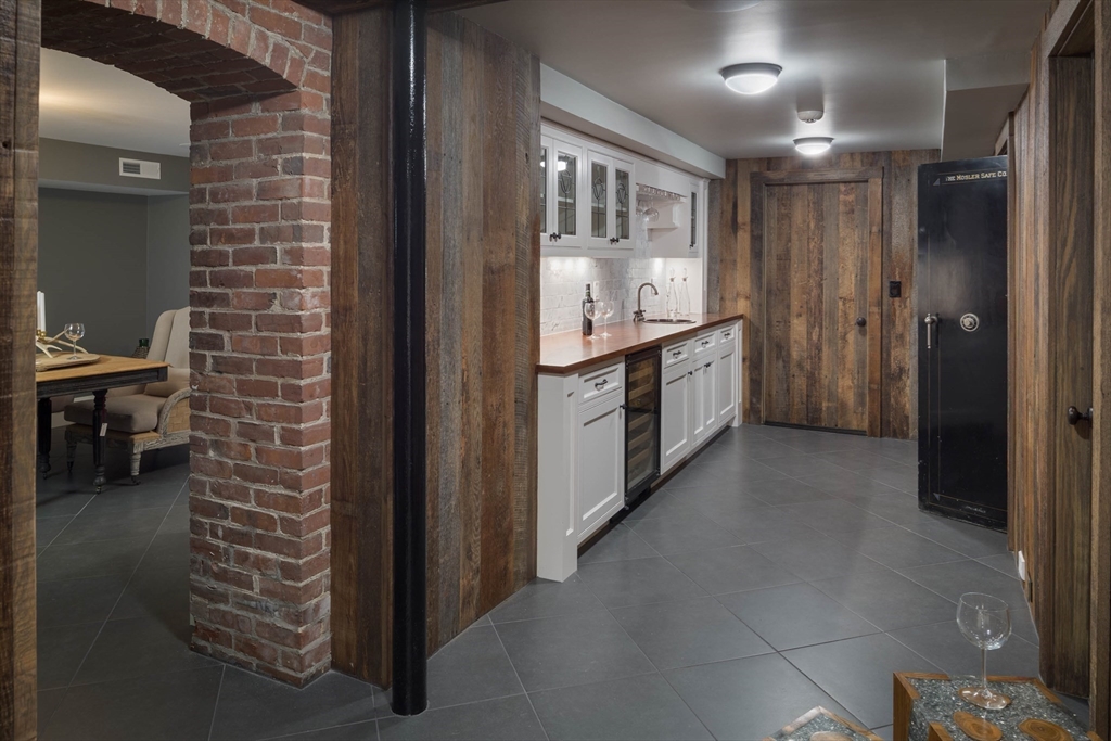 1 Adams Street Lexington, MA 02420 - Photo 19 of 20 a bathroom with a sink a mirror and a shower