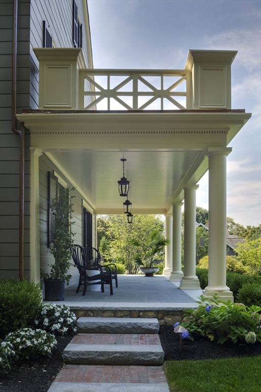 1 Adams Street Lexington, MA 02420 - Photo 2 of 20 a front view of a house with garden