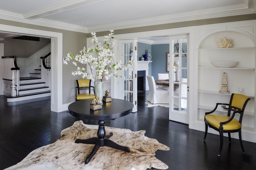 1 Adams Street Lexington, MA 02420 - Photo 7 of 20 a living room with furniture and a chandelier