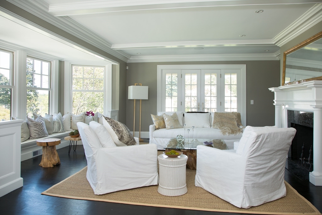 1 Adams Street Lexington, MA 02420 - Photo 8 of 20 a living room with fireplace furniture and a large window