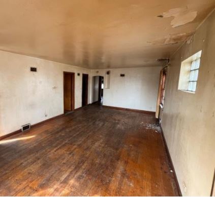 458 Rice Avenue Bellwood, IL 60104 - Photo 3 of 8 a view of a big room with wooden floor and staircase