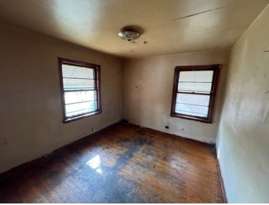 458 Rice Avenue Bellwood, IL 60104 - Photo 4 of 8 an empty room with a window