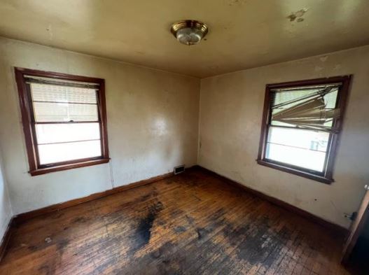 458 Rice Avenue Bellwood, IL 60104 - Photo 5 of 8 a view of an empty room with a window