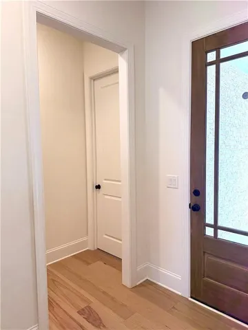 a kitchen with a refrigerator and cabinets