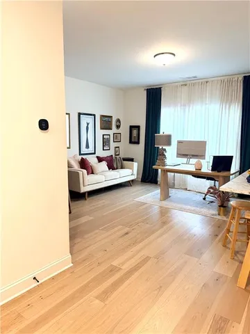 a view of a living room and dining room