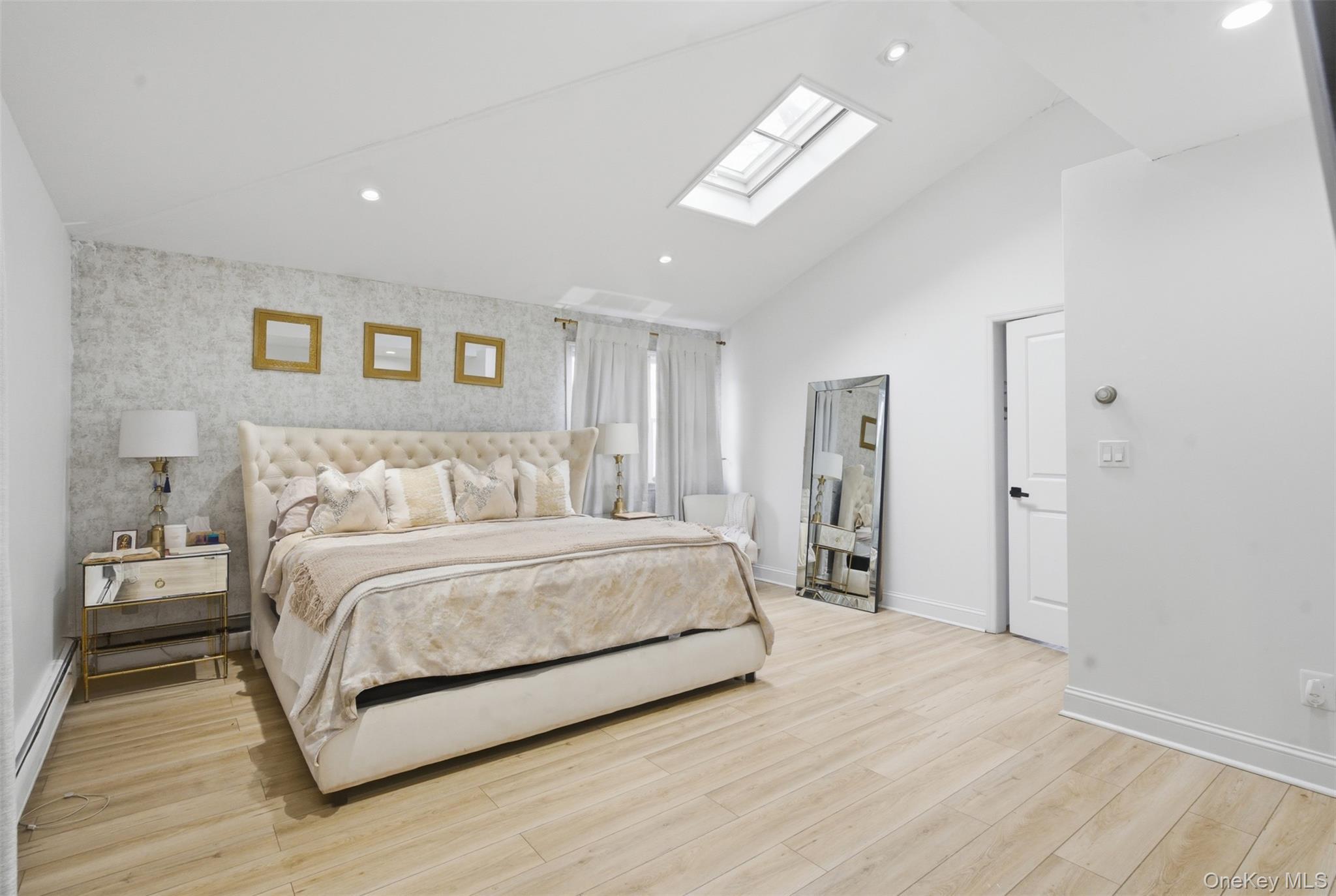 2 Olympus Road Highland Mills, NY 10930 - Photo 15 of 31 a spacious bedroom with a bed and a chandelier