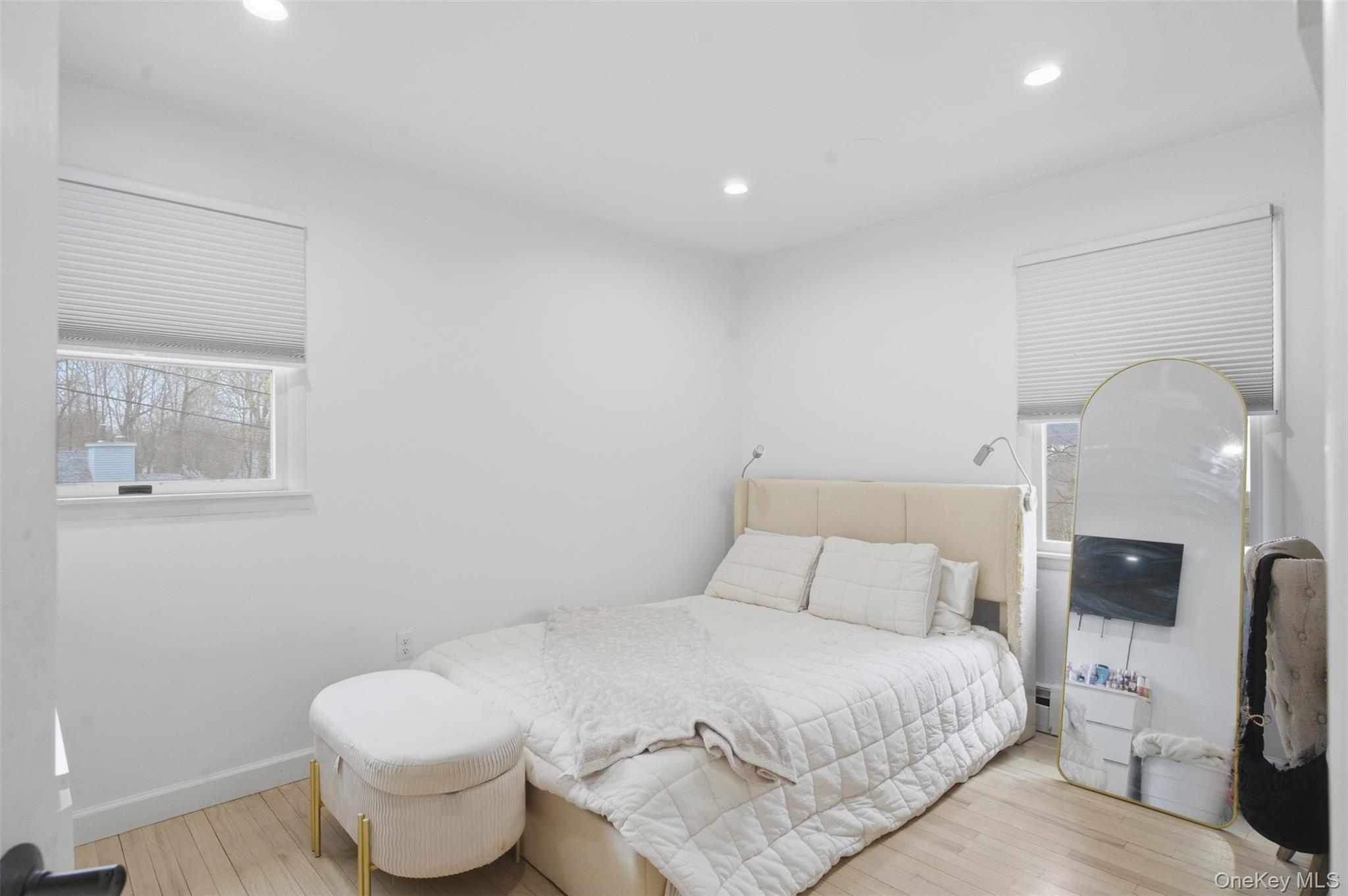 2 Olympus Road Highland Mills, NY 10930 - Photo 24 of 31 a bedroom with a bed and a painting on the wall