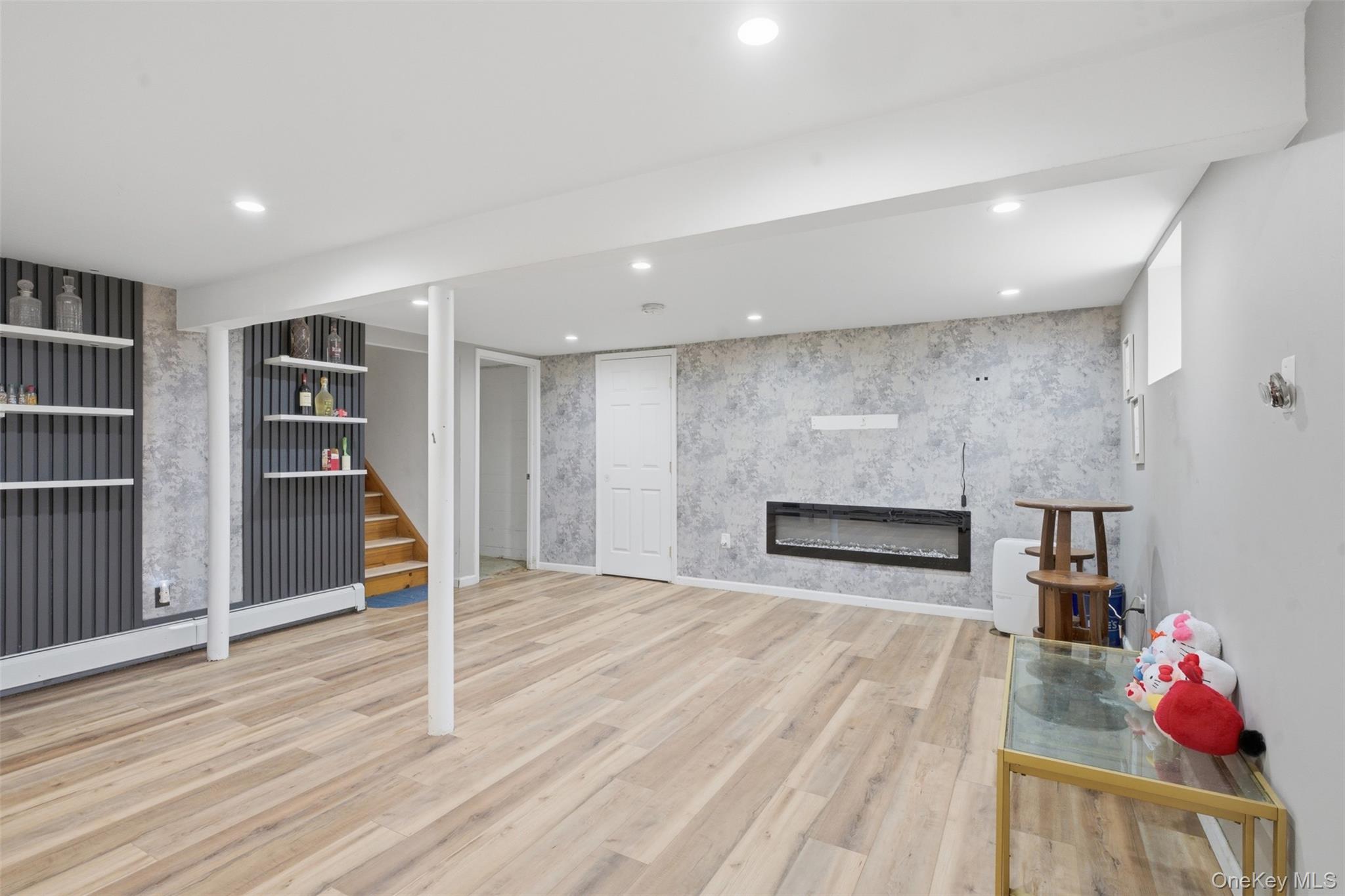 2 Olympus Road Highland Mills, NY 10930 - Photo 26 of 31 a living room with hard wood floors and a fireplace