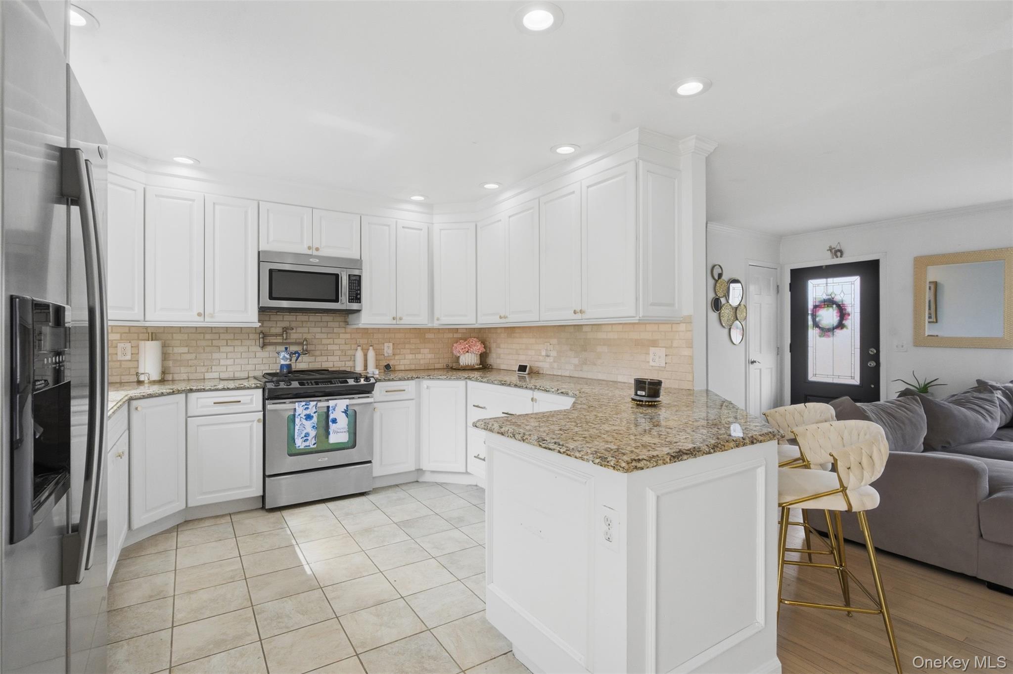 2 Olympus Road Highland Mills, NY 10930 - Photo 8 of 31 a kitchen with a sink white cabinets and stainless steel appliances