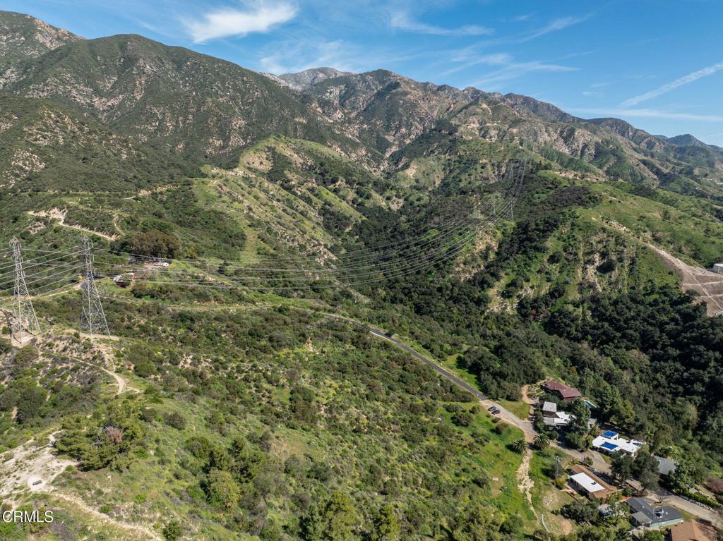 4700 Rising Hill Road Altadena, CA 91001 - Photo 11 of 35 a view of a mountain range with lush green forest