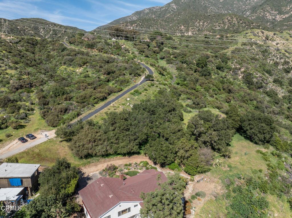 4700 Rising Hill Road Altadena, CA 91001 - Photo 34 of 35 an aerial view of a houses with a lush green hillside