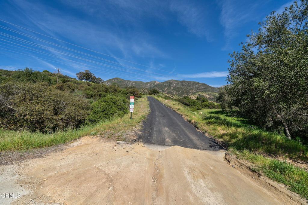 4700 Rising Hill Road Altadena, CA 91001 - Photo 5 of 35 a view of a road with a yard