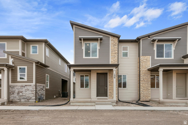 1302 East 1670th North, Unit 908 Payson, UT 84651 - Photo 1 of 21 View of front of property featuring stone siding and covered porch