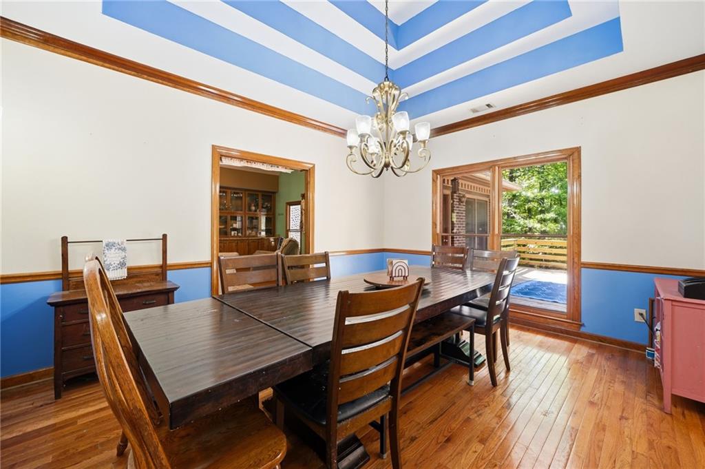 2737 John Petree Road Powder Springs, GA 30127 - Photo 11 of 55 a view of a dining room with furniture window and wooden floor