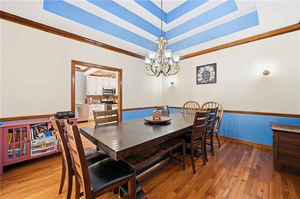 2737 John Petree Road Powder Springs, GA 30127 - Photo 12 of 55 a view of a dining room with furniture and wooden floor