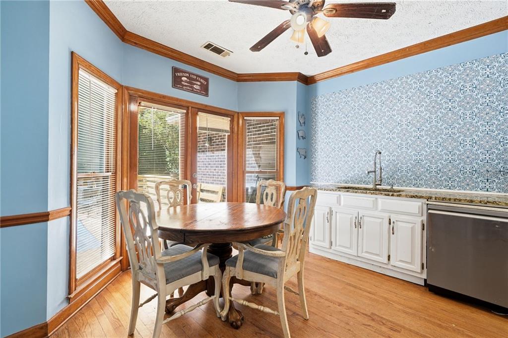 2737 John Petree Road Powder Springs, GA 30127 - Photo 17 of 55 a view of a dining room with furniture window and wooden floor