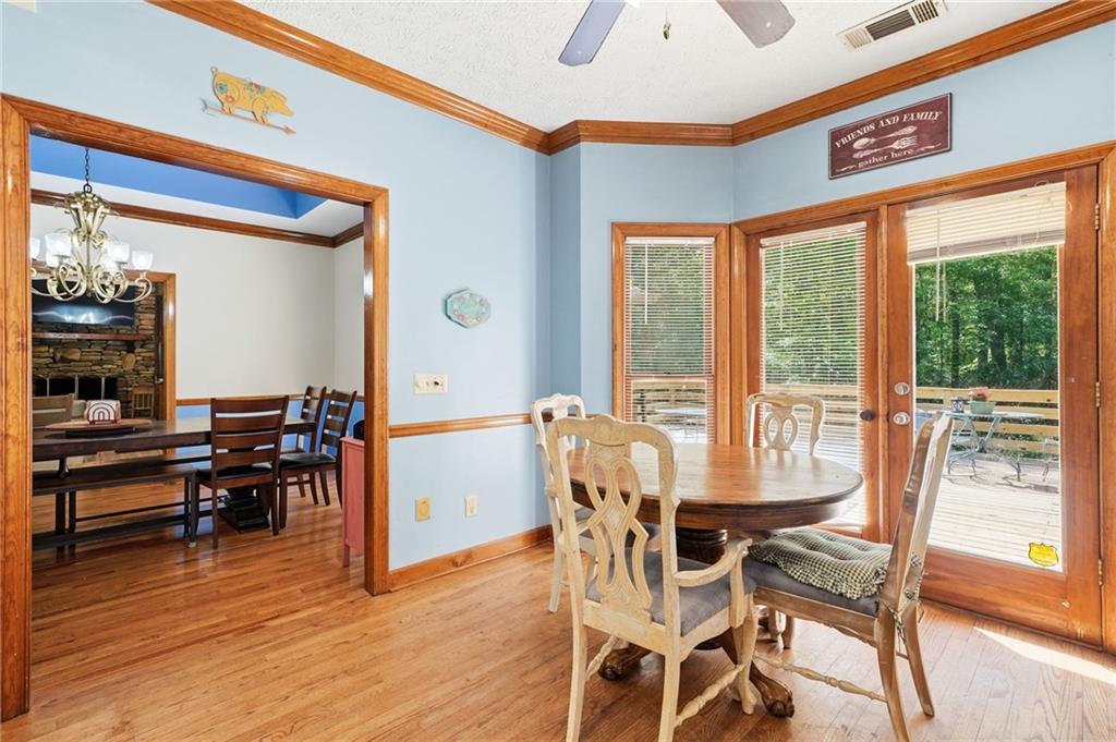 2737 John Petree Road Powder Springs, GA 30127 - Photo 18 of 55 a view of a dining room with furniture window and wooden floor