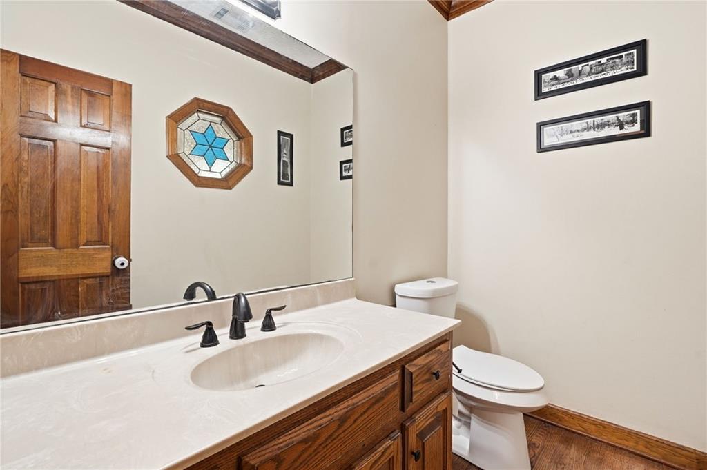 2737 John Petree Road Powder Springs, GA 30127 - Photo 22 of 55 a bathroom with a sink a toilet and a mirror
