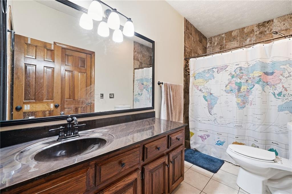 2737 John Petree Road Powder Springs, GA 30127 - Photo 27 of 55 a bathroom with a sink and a mirror