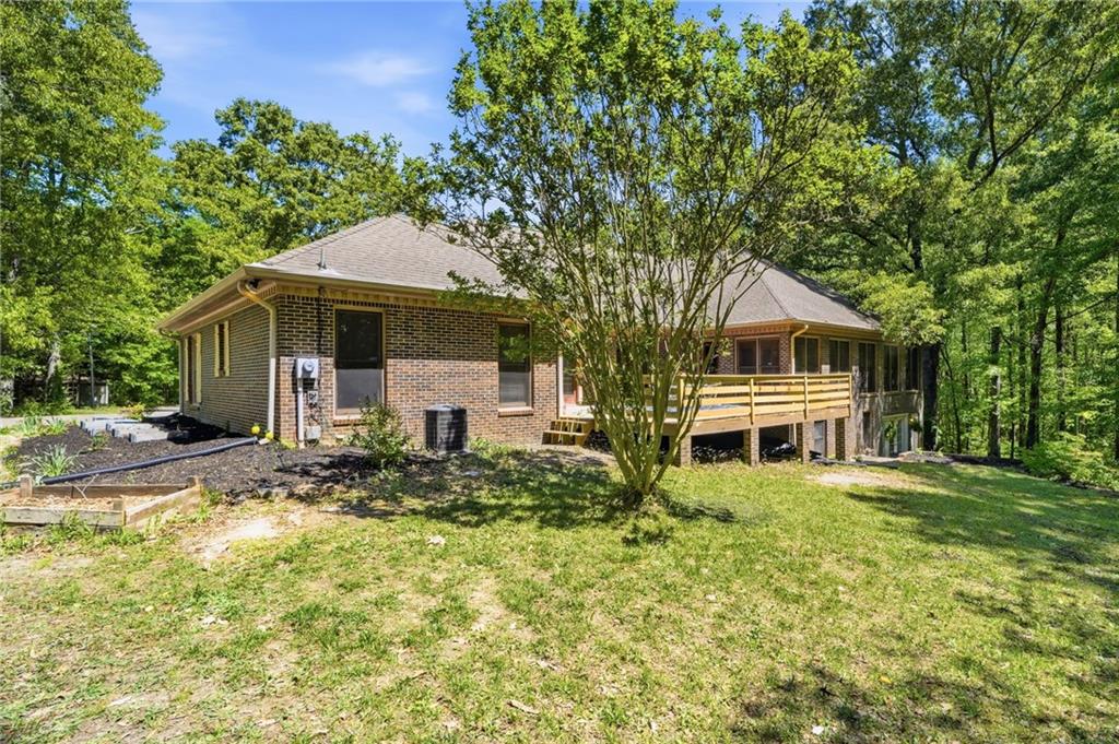 2737 John Petree Road Powder Springs, GA 30127 - Photo 50 of 55 a front view of a house with a yard