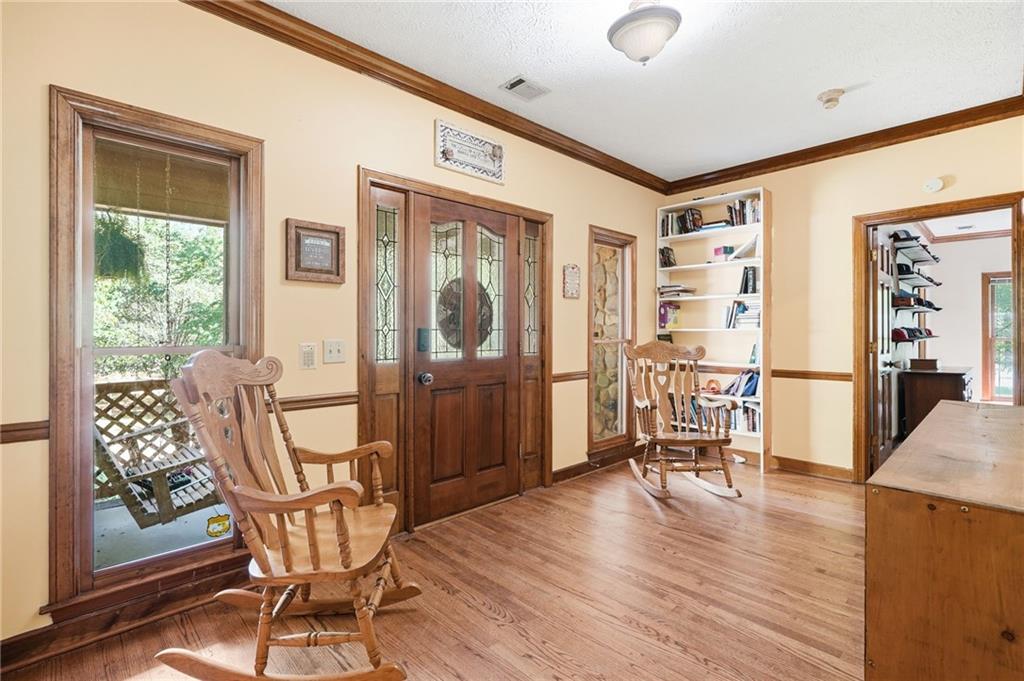 2737 John Petree Road Powder Springs, GA 30127 - Photo 7 of 55 a dining room with furniture and wooden floor