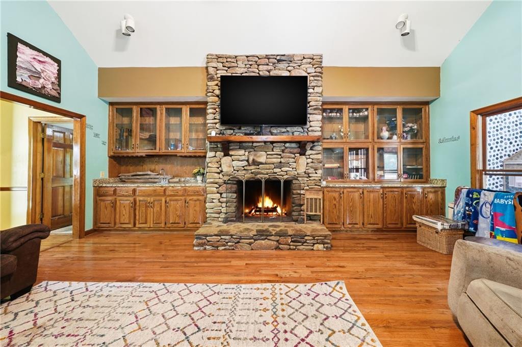 2737 John Petree Road Powder Springs, GA 30127 - Photo 8 of 55 a living room with fireplace furniture and a flat screen tv