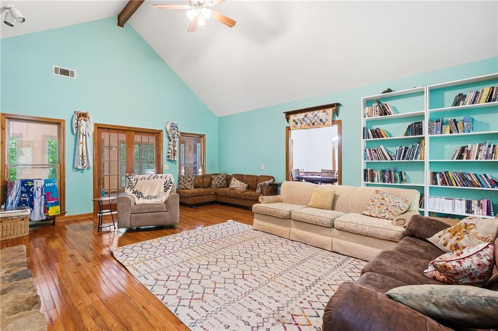 2737 John Petree Road Powder Springs, GA 30127 - Photo 10 of 55 a living room with furniture and a book shelf