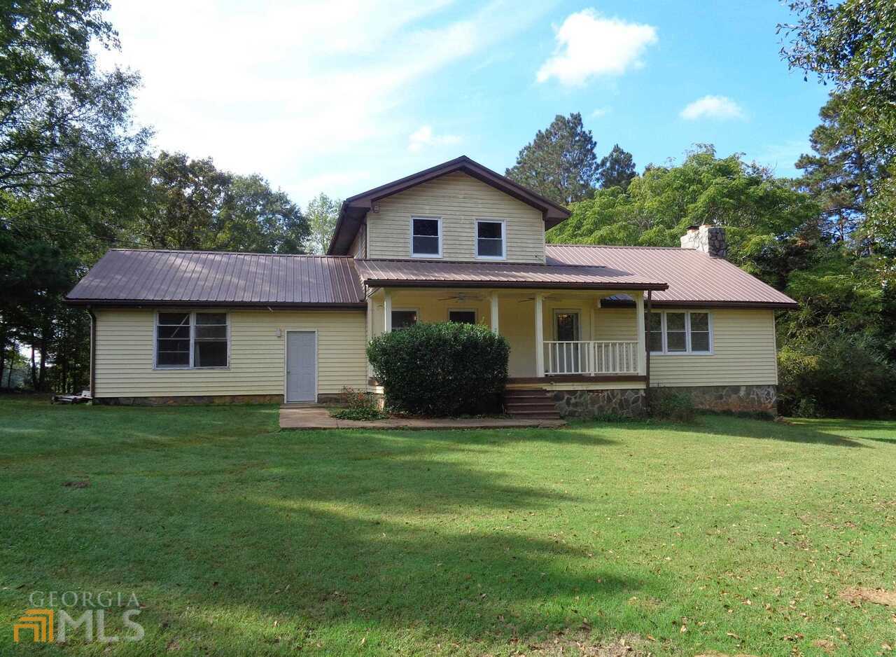 1890 Swint Road Griffin, GA 30224 - Photo 1 of 1 a view of a house with a yard and sitting area