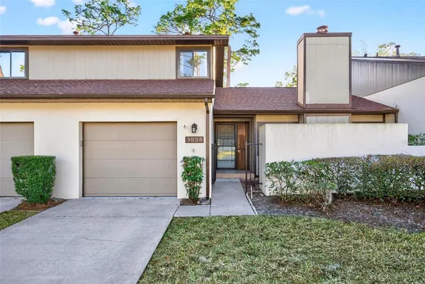 front view of a house with a small yard