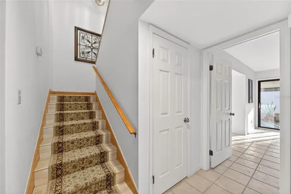 a view of a room with wooden floor and white walls