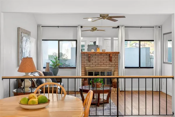 a view of a dining room with furniture window and wooden floor