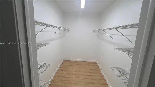 a view of a house with backyard and patio