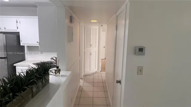a view of a kitchen with a sink and dishwasher cabinets