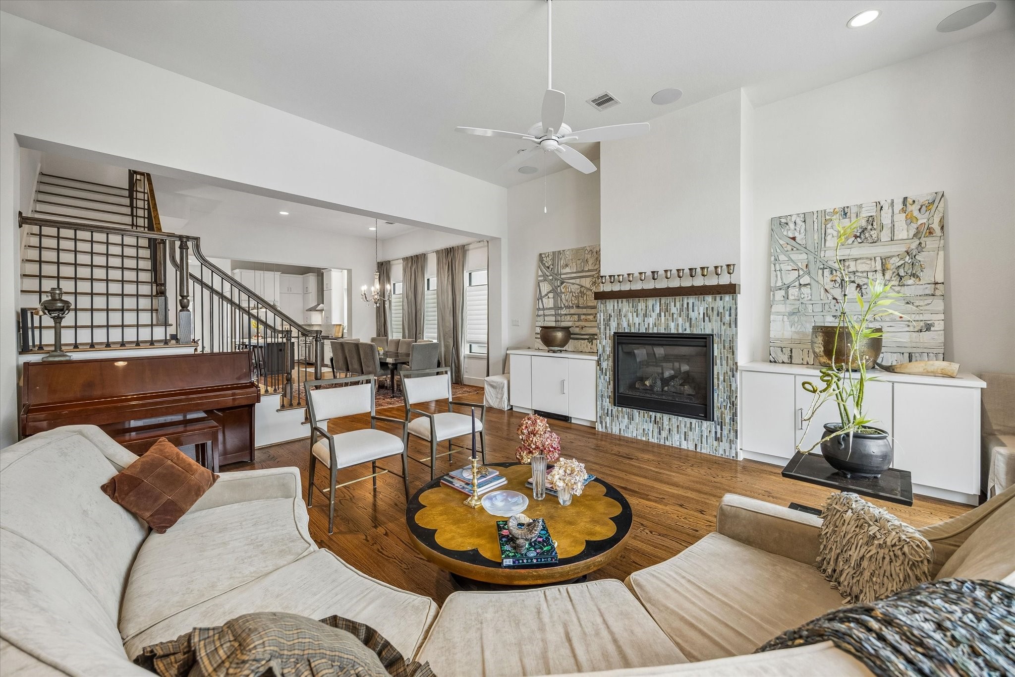1526 Vermont Street Houston, TX 77006 - Photo 14 of 39 Open-concept living area anchored by a stylish fireplace and designed for both comfortable everyday living and entertaining.
