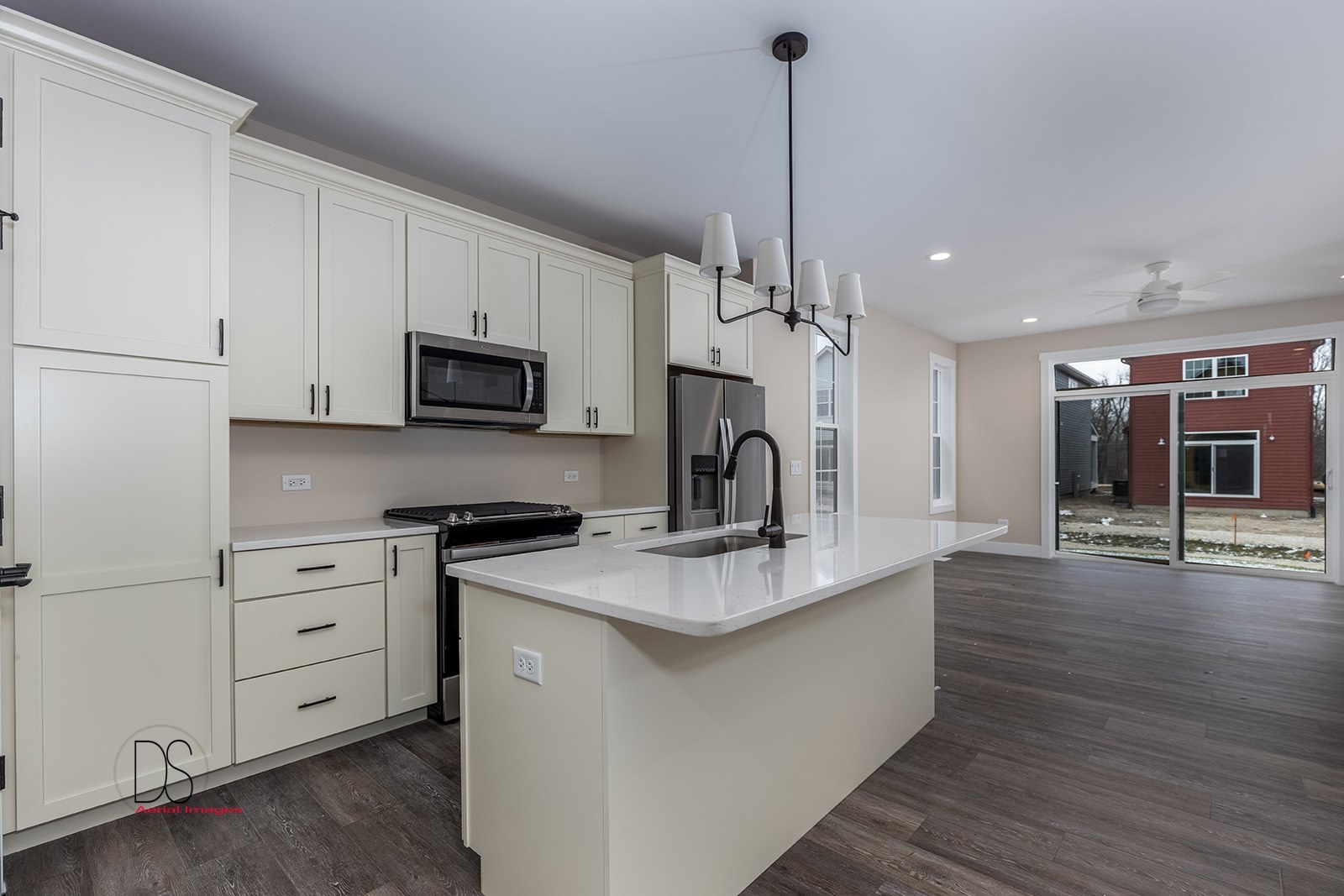 100 Great Loop E Drive, Unit 52 Ottawa, IL 61350 - Photo 3 of 13 a kitchen with stainless steel appliances granite countertop a sink a stove and a wooden floors