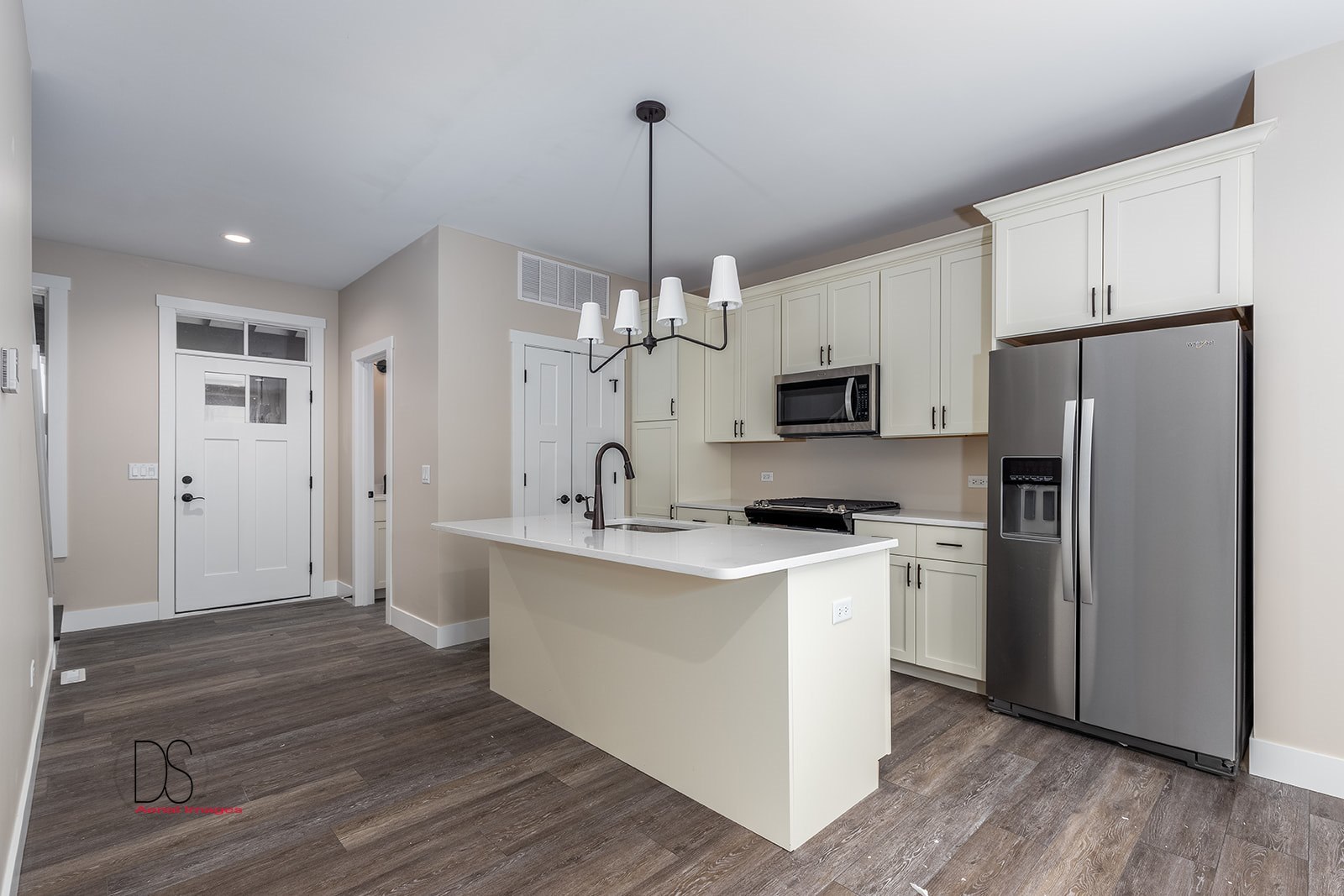 100 Great Loop E Drive, Unit 52 Ottawa, IL 61350 - Photo 4 of 13 a kitchen with kitchen island a white counter top space cabinets and stainless steel appliances