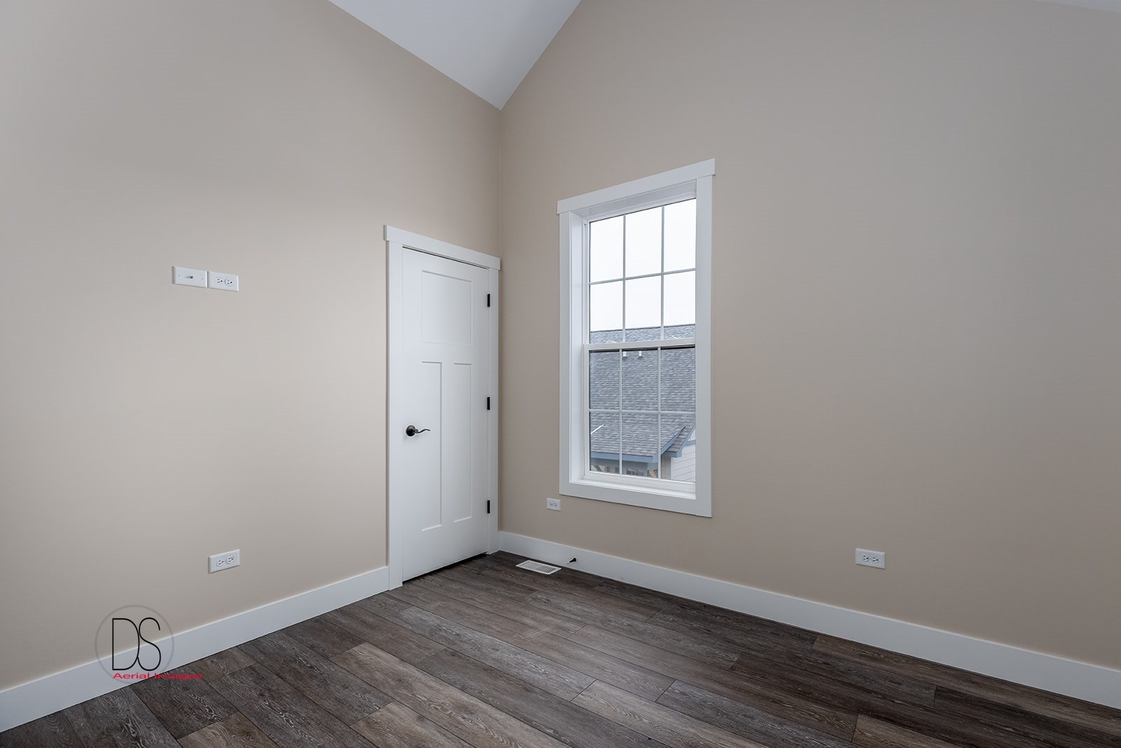 100 Great Loop E Drive, Unit 52 Ottawa, IL 61350 - Photo 8 of 13 an empty room with wooden floor and windows