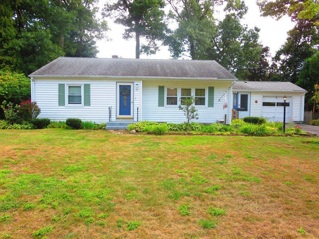 45 Hadley Street Springfield, MA 01118 - Photo 1 of 21 a front view of house with yard and green space