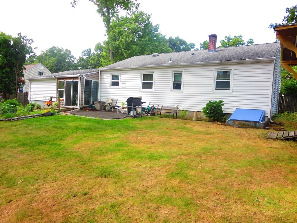 45 Hadley Street Springfield, MA 01118 - Photo 17 of 21 a view of a house with a yard and sitting area