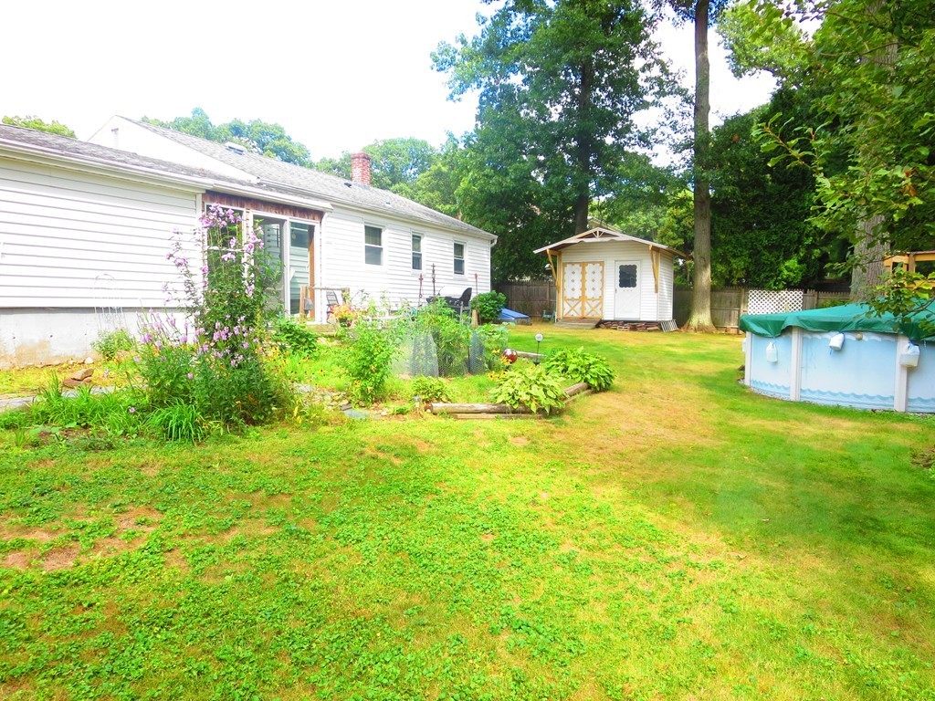 45 Hadley Street Springfield, MA 01118 - Photo 21 of 21 a front view of a house with a yard and trees