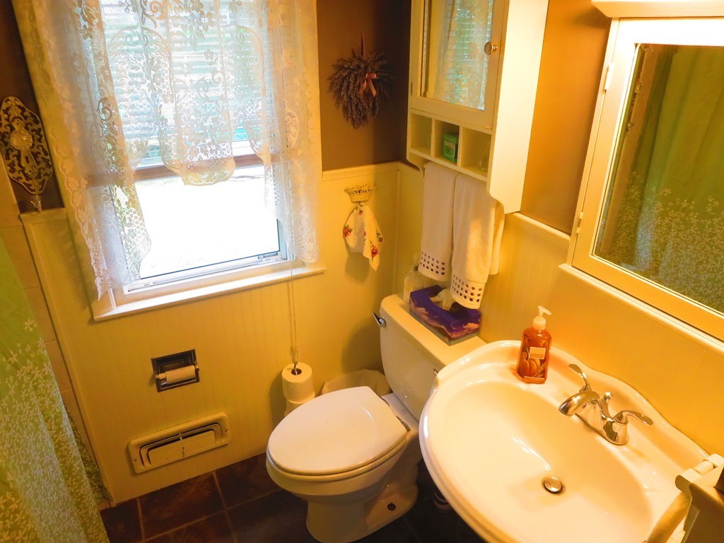 45 Hadley Street Springfield, MA 01118 - Photo 8 of 21 a bathroom with a sink and a mirror