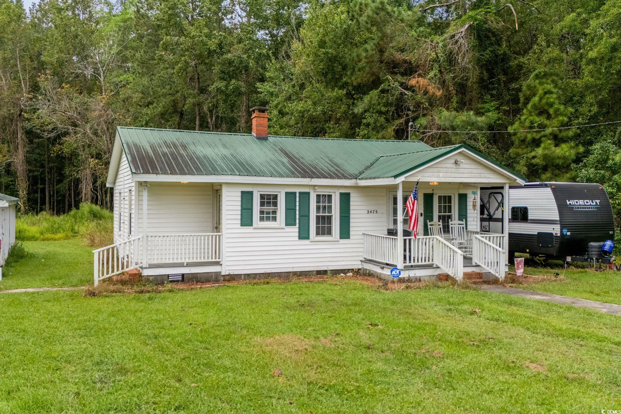 2475 Beverly Road Conway, SC 29527 - Photo 1 of 34 View of front of home featuring crawl space, a front yard, a porch, and a metal roof