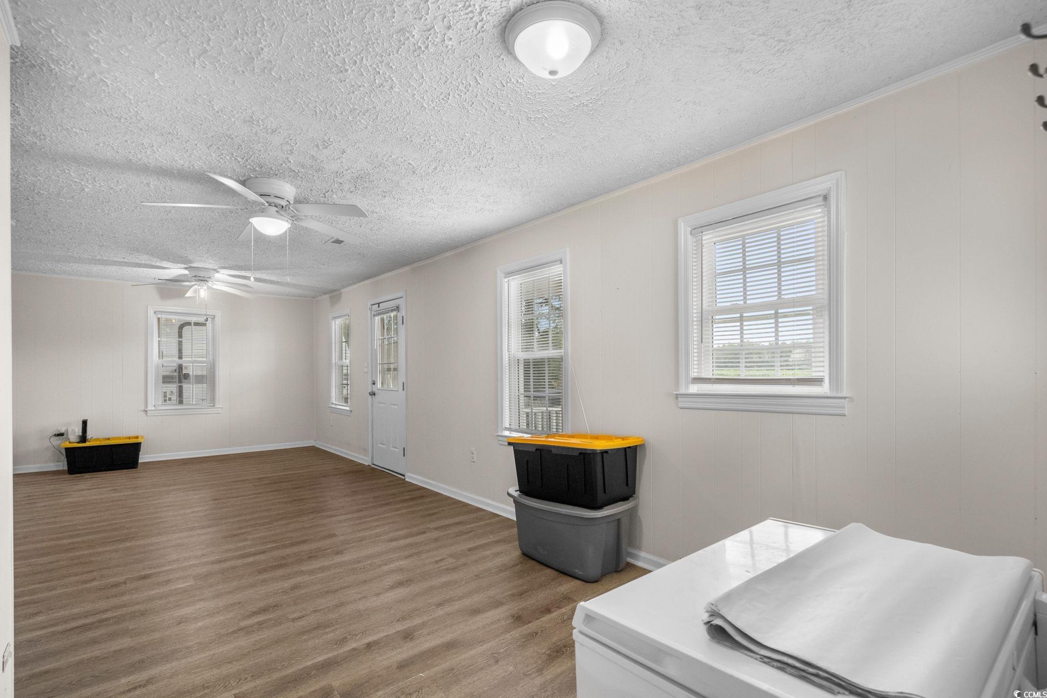 2475 Beverly Road Conway, SC 29527 - Photo 13 of 34 Interior space with wood finished floors, a textured ceiling, ceiling fan, and ornamental molding