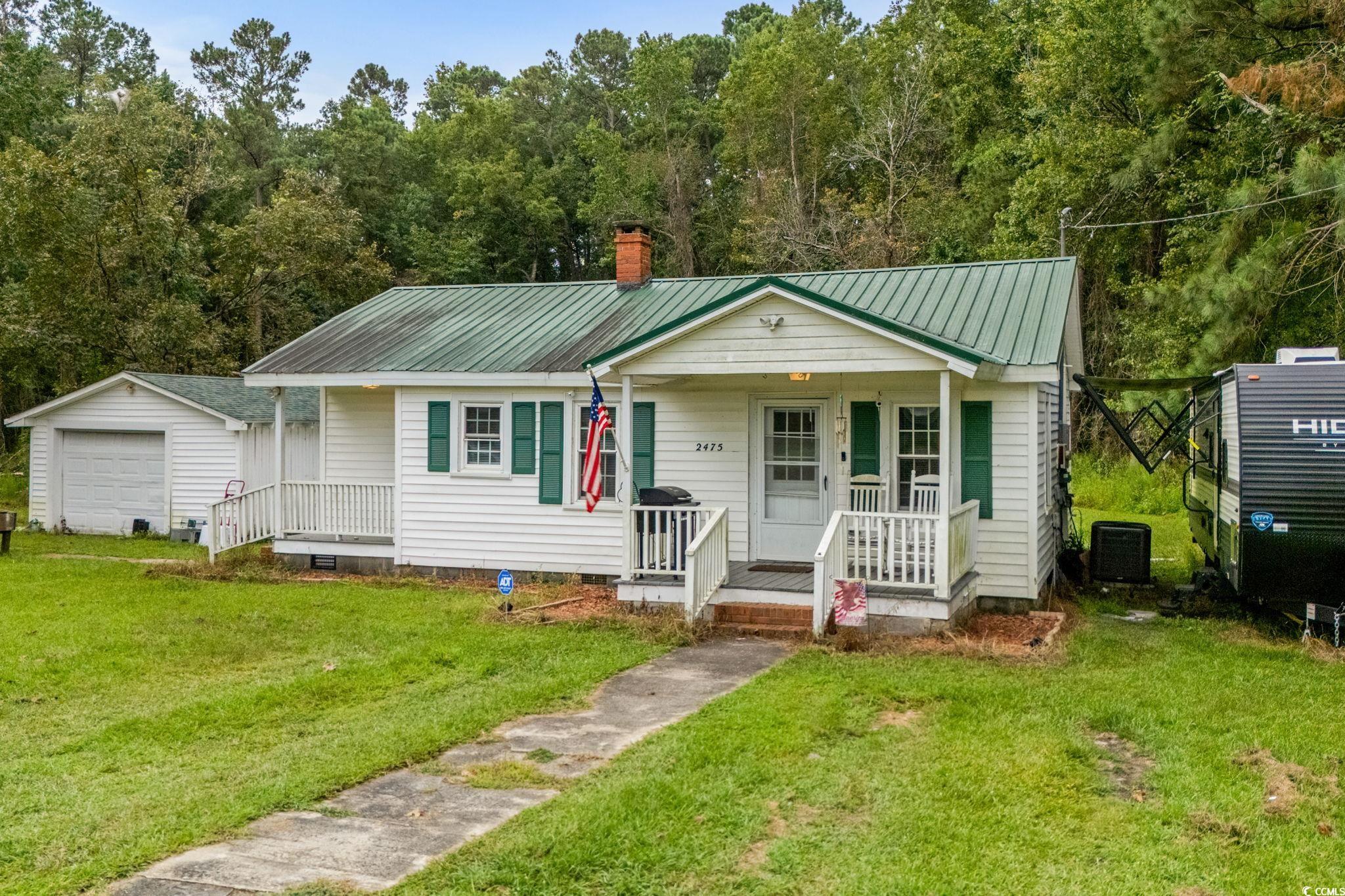 2475 Beverly Road Conway, SC 29527 - Photo 2 of 34 Bungalow-style house featuring a metal roof, a front lawn, an outdoor structure, and covered porch