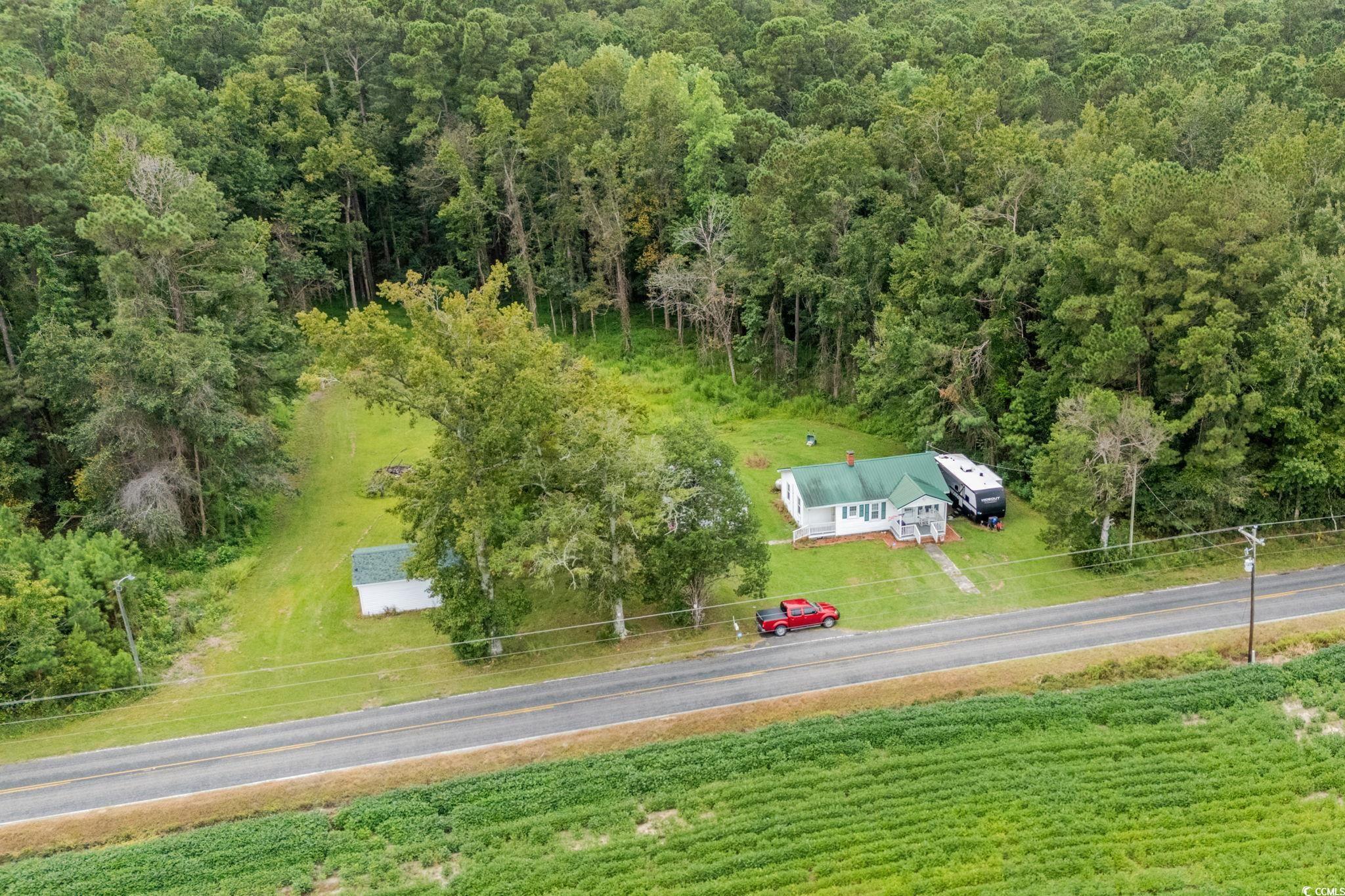 2475 Beverly Road Conway, SC 29527 - Photo 32 of 34 Aerial view of property and surrounding area with a forest