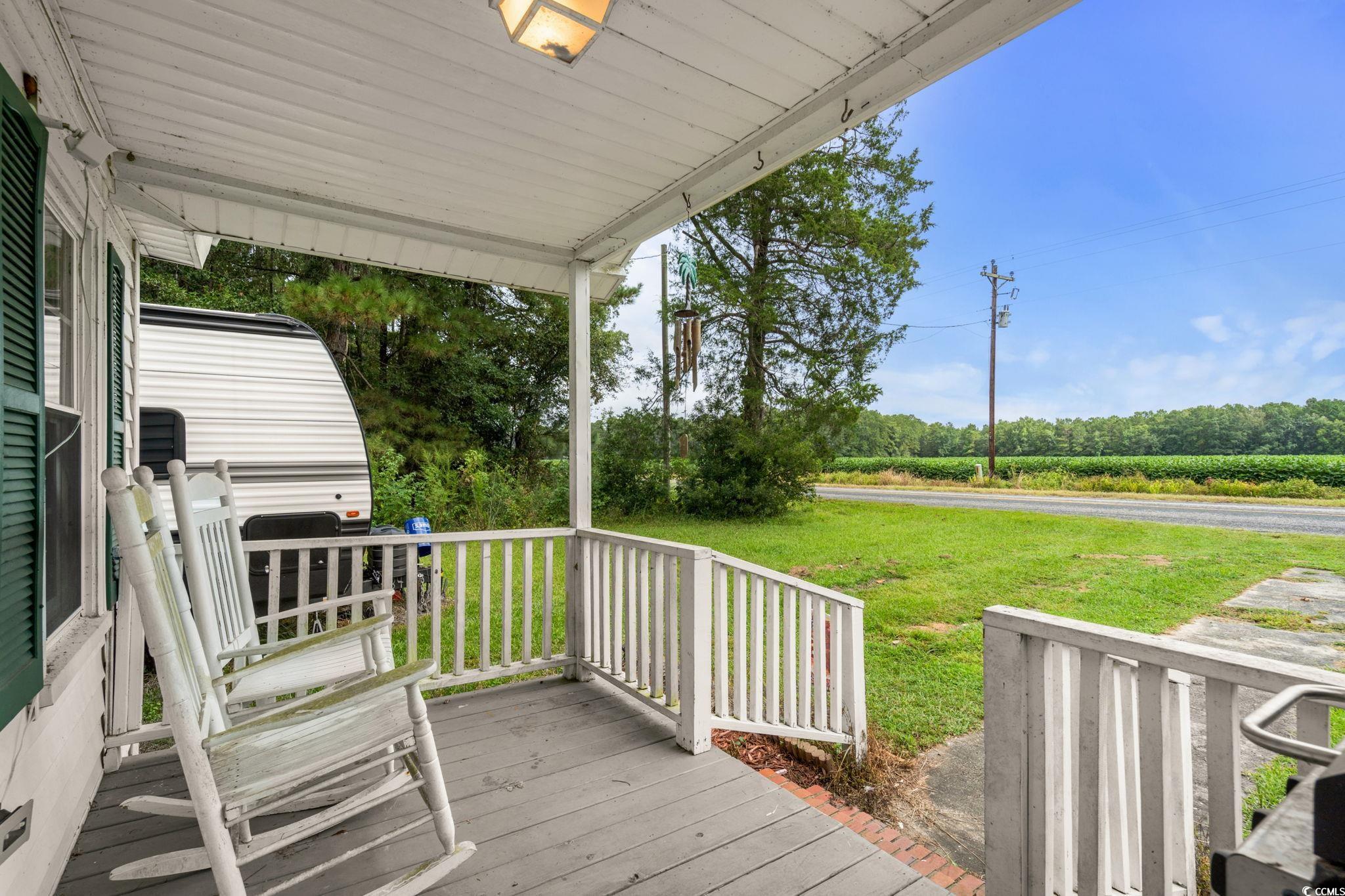 2475 Beverly Road Conway, SC 29527 - Photo 7 of 34 Wooden porch with a lawn