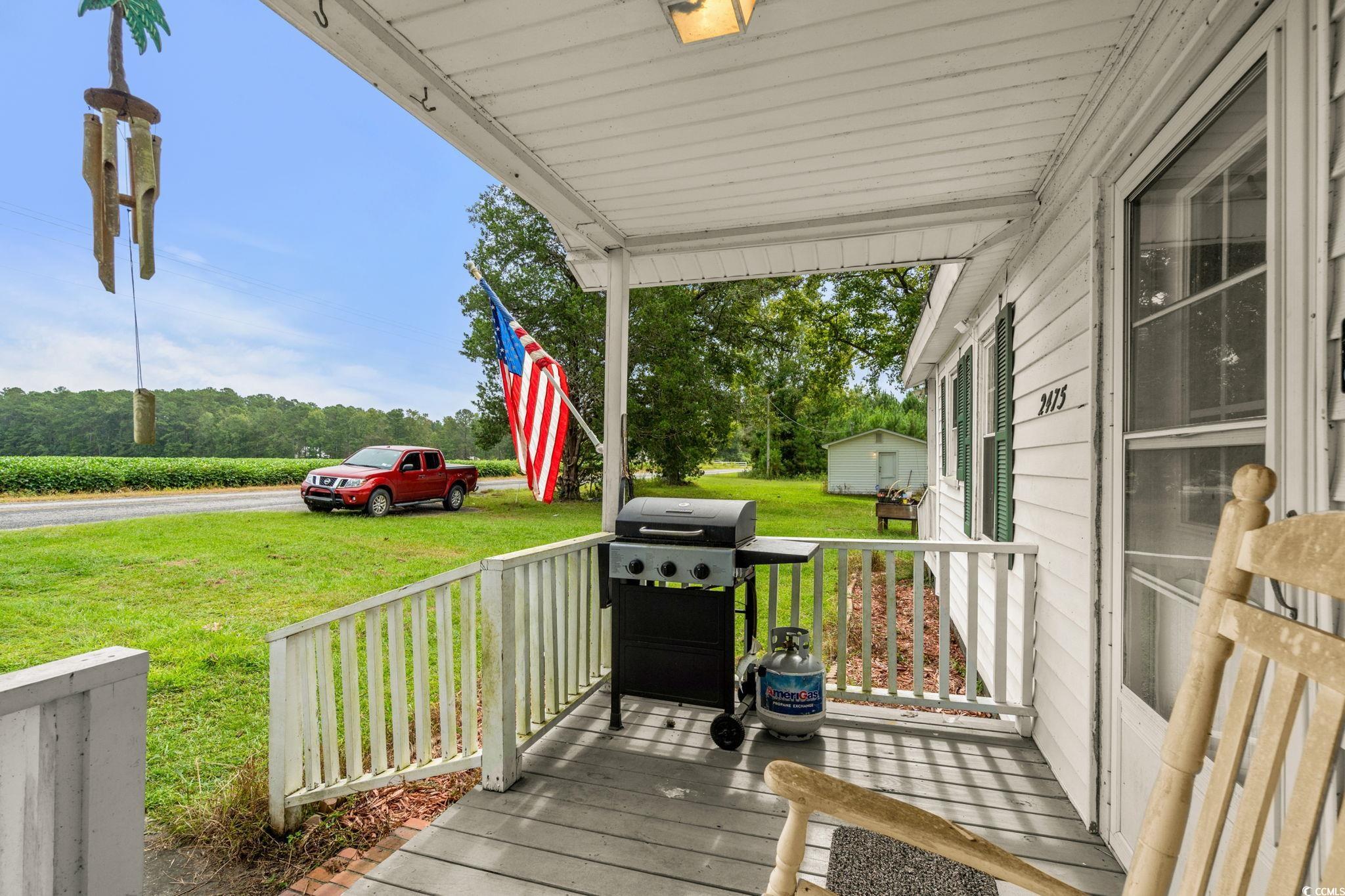 2475 Beverly Road Conway, SC 29527 - Photo 8 of 34 Wooden porch with grilling area and a lawn