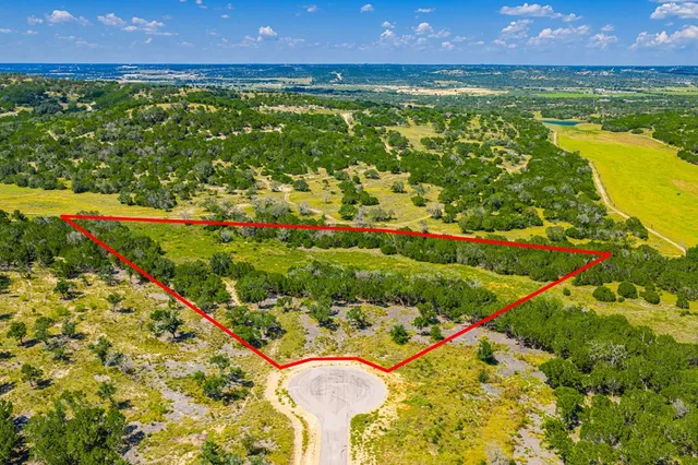 a view of large building with a road in the background