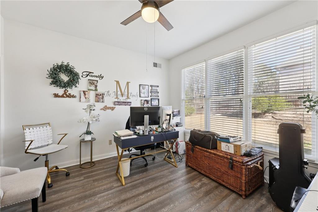 704 Highland Ridge Pointe Lawrenceville, GA 30045 - Photo 13 of 36 a living room with furniture and a large window